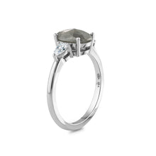 Load image into Gallery viewer,  This unique engagement ring combines traditional and modern elements, featuring a 1.59ct oval salt &amp; pepper diamond from the grey diamond family. It&#39;s accented by two pear-shaped diamonds totaling 0.32ct each, set in 18K white gold.
