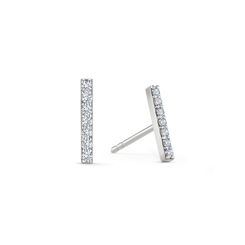 Elegant earrings in 18K white gold, each featuring seven round brilliant diamonds totaling approximately 0.140tcw in a sleek bar design, offering a delicate yet impactful geometric style.