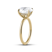 Load image into Gallery viewer, Elegant engagement ring in 18K yellow gold, featuring a 2ct Moissanite Oval with eagle claw setting, and a hidden halo of 0.05ct in 14 small diamonds, offering a modern look with exceptional sparkle.
