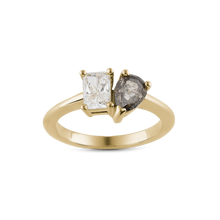 Load image into Gallery viewer, Unique engagement ring in 18K yellow gold, featuring a 0.72ct princess cut lab diamond and a 0.85ct pear-shaped salt &amp; pepper diamond, embodying a blend of classic and unconventional beauty.
