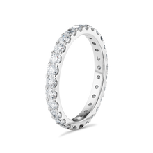 Load image into Gallery viewer, Elegant full eternity band in 18K white gold, featuring 1.35tcw of round brilliant diamonds evenly spaced around the band, symbolizing endless love and partnership.
