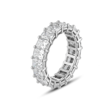 Load image into Gallery viewer, Luxurious 18K white gold band featuring 5.82 carats of end-to-end radiant cut VS/E-F lab-grown diamonds, set in fine prongs with a total of 19 diamonds. The band showcases a geometric echo pattern inside, reminiscent of intricate scaffolding, emphasizing strength and vitality.
