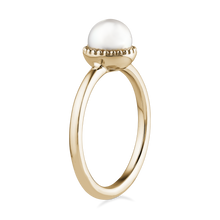 Load image into Gallery viewer, Elegant pearl promise ring in 14K yellow gold, featuring a 6-6.5mm round white pearl set in a textured milgrain frame, symbolizing tradition and history, handcrafted by Ex Aurum in Montreal.

