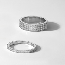 Load image into Gallery viewer, Striking ring in 14K white gold, weighing approximately 5.3gr, featuring three rows of pavé set diamonds totaling 0.63tcw, designed as a half eternity band for a bold contemporary-modern look.
