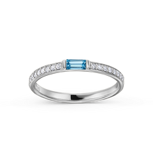 Load image into Gallery viewer, Elegant ring in 14K white gold, handcrafted by Ex Aurum in Montreal, featuring a soft sky-blue topaz baguette center with 0.13ctw diamond pavé along the sides, creating a refreshing and colorful touch.
