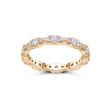 Load image into Gallery viewer, Dazzling full eternity ring in 18K yellow gold, featuring 1.05tcw of mixed-sized round brilliant diamonds pave set in leaflike sections, radiating life vitality and sparkling diamond fire.
