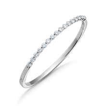 Load image into Gallery viewer, Elegant 18K white gold bangle featuring 17 round brilliant diamonds totaling approximately 1.19ctw, set in a shared prong technique for a contemporary and airy design, creating a dazzling effect.
