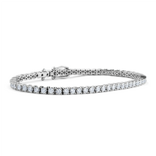Load image into Gallery viewer, Luxurious 18K white gold bracelet featuring approximately 4.48ct total weight in claw-set round brilliant diamonds, with a seamless box clasp and double safety clip, measuring about 7 inches in length, crafted by Ex Aurum in Montreal.
