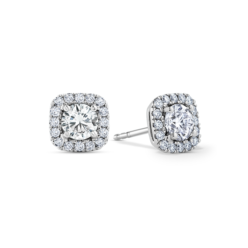 18K white gold and diamond stud earrings, featuring prong-set round brilliant diamonds with a pavé diamond cushion-shaped border, creating a striking interplay of shapes and reflections.