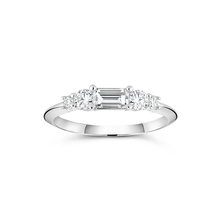 Load image into Gallery viewer, White gold engagement ring with a distinctive low knife-edged band, featuring a 0.31ct baguette cut diamond center, flanked by four round brilliant diamonds totaling 0.58tcw in prong settings, creating a scaffold-like structure.
