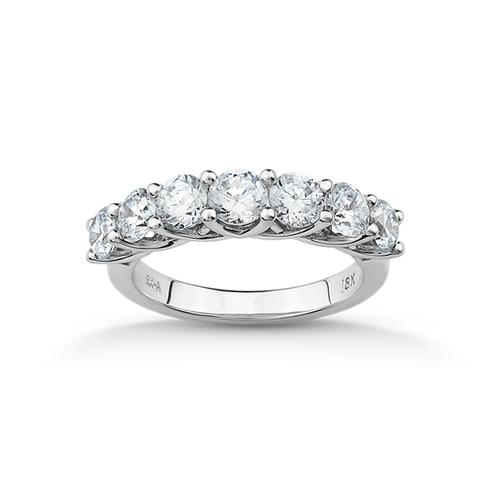 Sophisticated 18K white gold ring featuring seven round brilliant diamonds totaling an estimated 1.24tcw, set in a unique 'U' shaped gallery, embodying a blend of elegance and modern style.