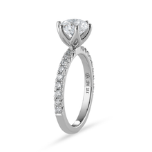Load image into Gallery viewer, Stunning 18K white gold solitaire ring, featuring a 1.20ct round brilliant VS1 D diamond in a six-claw setting, with a flame-shaped design and 0.36tcw pavé set diamonds along three-quarters of the slim band.
