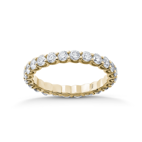 Exquisite full eternity ring in 18K yellow gold, featuring 1.44tcw of round brilliant diamonds, each 0.06ct, set in a unique scalloped gallery style with shared claw settings, blending tradition with modern design.