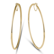 Load image into Gallery viewer, 18K yellow gold hoop earrings, measuring approximately 72mm in diameter with a 2.5mm tube, designed for all-day comfort and a strong shape, crafted with Italian elegance.
