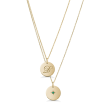 Load image into Gallery viewer, Unique double-sided 14K yellow gold pendant, featuring a script-styled initial on one side and a gemstone set in a diamond-cut star pattern on the reverse, measuring 15mm in diameter, accompanied by an 18&quot; adjustable chain.
