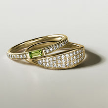 Load image into Gallery viewer, Elegant 14K yellow gold ring with a dynamic character, featuring a peridot baguette and 0.13ctw of diamonds in a combined pavé and bar setting.
