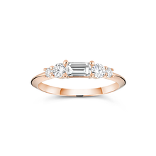 Load image into Gallery viewer, Rose gold engagement ring with a distinctive low knife-edged band, featuring a 0.31ct baguette cut diamond center, flanked by four round brilliant diamonds totaling 0.58tcw in prong settings, creating a scaffold-like structure.
