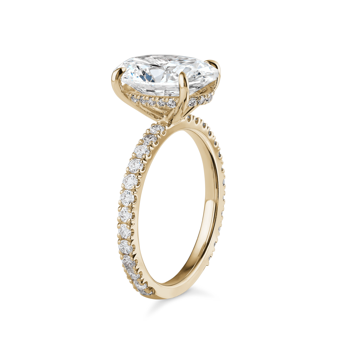 Luxurious engagement ring in 18K yellow gold, featuring a 3.09ct oval lab diamond (VS1 H) with a hidden pavé diamond halo and 0.55tcw of small round diamonds along the band, offering a blend of simplicity and detailed elegance.