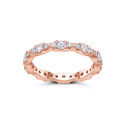 Elegant band in 14K rose gold, weighing approximately 2.25gr, featuring mixed-sized round brilliant diamonds totaling about 0.75tcw, set in leaflike slivers for a lively and sparkling effect.