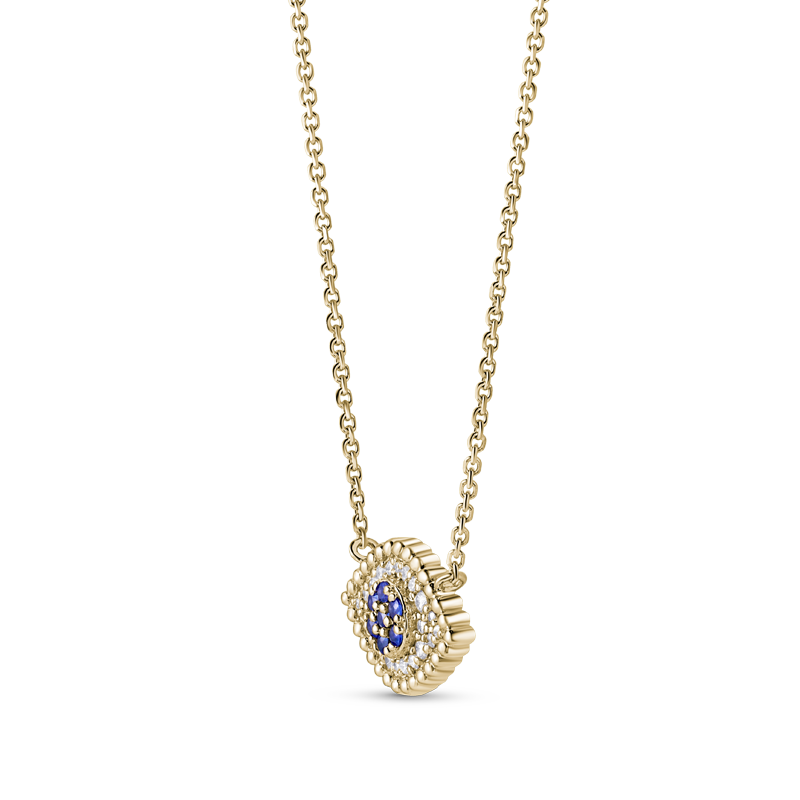 Pendant necklace, exquisitely handcrafted by Ex Aurum in Montreal, is made from 14K yellow gold and features a symbolic evil eye design. It's adorned with 0.11tcw of round brilliant diamonds and a 0.07ct round sapphire. This piece is said to offer protection and good luck.