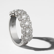 Load image into Gallery viewer, Exquisite ring in 18K white gold, handcrafted in Montreal by Ex Aurum, featuring seven feature diamonds surrounded by a continuous scalloped halo, with a total of approximately 53 diamonds and weighing about 5gr, showcasing a gleaming and elegant design.
