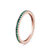 Load image into Gallery viewer, 14K rose gold eternity band, adorned with 0.27tcw of vibrant round emeralds, representing eternal love and commitment, perfect for adding a touch of color and brilliance.
