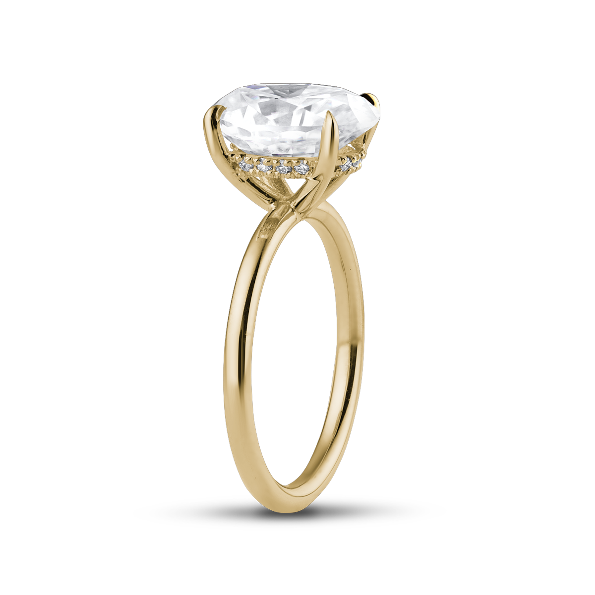 Elegant engagement ring in 18K yellow gold, featuring a 2ct Moissanite Oval with eagle claw setting, and a hidden halo of 0.05ct in 14 small diamonds, offering a modern look with exceptional sparkle.