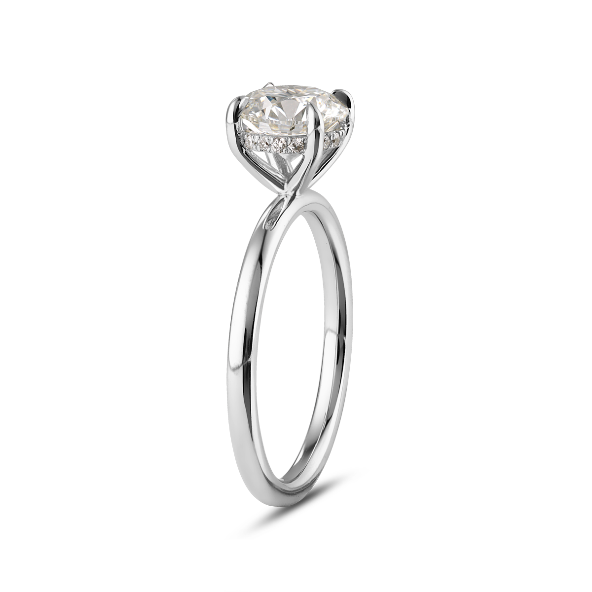 Elegant solitaire in 18K white gold, featuring a round brilliant laboratory diamond in an eagle claw setting, surrounded by a hidden halo of 16 small diamonds totaling 0.08tcw, blending classic and contemporary styles.