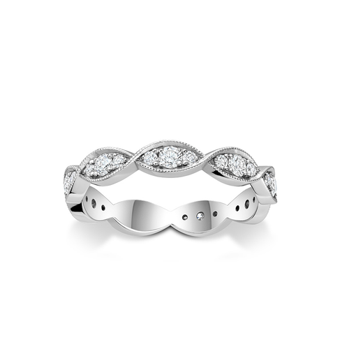 Full eternity ring in 18K white gold, featuring over 1/2 carat of pavé set diamonds twisted in a 360-degree motion, encased between waving raised ribs, creating a shimmering dance of light.