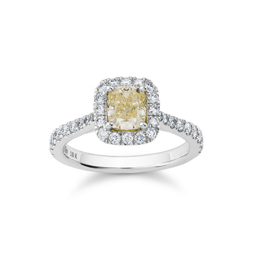 Luxurious ring in 18K white gold, featuring a 0.98ct fancy yellow diamond centerpiece surrounded by a halo and 34 diamonds totaling 0.48tcw, creating a dazzling display of brilliance and color.