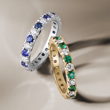 Load image into Gallery viewer, Full eternity ring in 18K white gold, beautifully set with round cut diamonds and sapphires, showcasing the vivid colors and brilliance of the gemstones, crafted with precision by Ex Aurum in Montreal.
