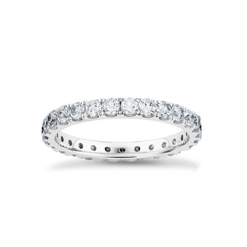 Elegant full eternity band in 18K white gold, featuring 1.35tcw of round brilliant diamonds evenly spaced around the band, symbolizing endless love and partnership.