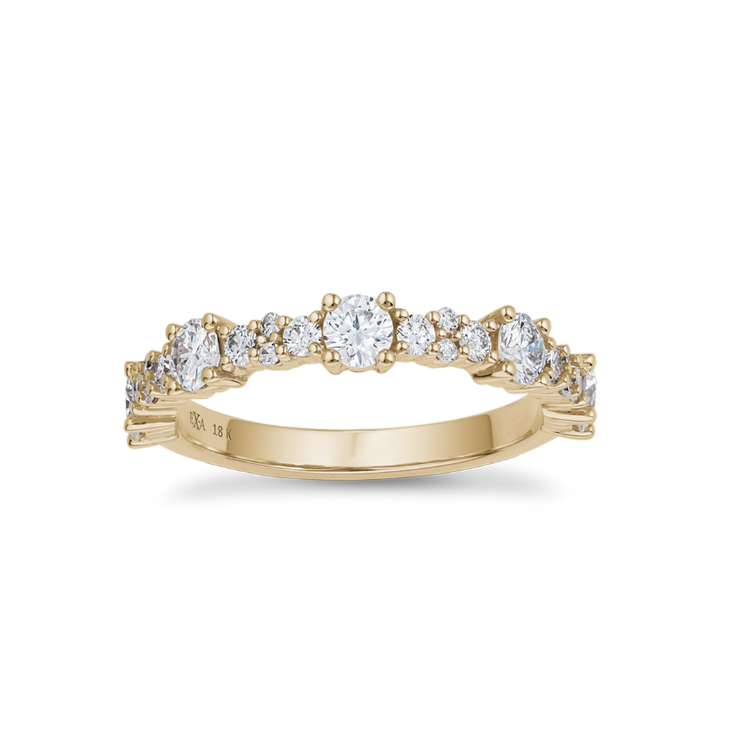 Elegant 18K yellow gold band featuring 21 round brilliant diamonds totaling approximately 0.75tcw in a fine prong setting, adorning the top half of the band.