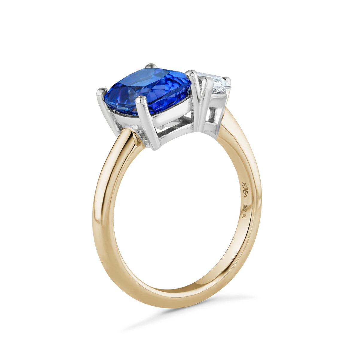 Exquisite ring in 18K white and yellow gold, featuring a 1ct pear-shaped lab diamond and a 2.81ct cushion-cut tanzanite, symbolizing unique and enduring beauty.