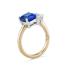 Load image into Gallery viewer, Exquisite ring in 18K white and yellow gold, featuring a 1ct pear-shaped lab diamond and a 2.81ct cushion-cut tanzanite, symbolizing unique and enduring beauty.
