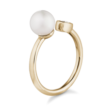 Charger l&#39;image dans la galerie, Elegant ring in 14K yellow gold, handcrafted by Ex Aurum in Montreal, featuring a 6.5-6.75mm round white pearl and a 0.09ct round brilliant diamond in a bezel setting, symbolizing purity and unity.
