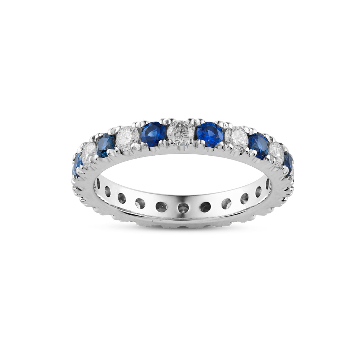 Full eternity ring in 18K white gold, beautifully set with round cut diamonds and sapphires, showcasing the vivid colors and brilliance of the gemstones, crafted with precision by Ex Aurum in Montreal.