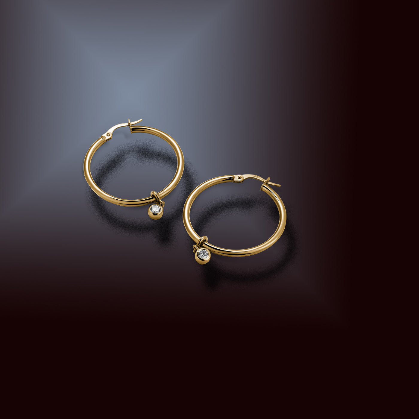 Versatile 14K yellow gold 19mm hoop earrings with detachable 0.10ct lab-diamond droplets, offering a transition from essential to elegant style, featuring bezel-set round brilliant lab diamonds totaling 0.20tcw.