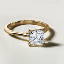 Load image into Gallery viewer, Stunning engagement ring in 18K yellow gold, featuring a 1.51ct princess cut laboratory diamond, SI1 G, set in a prong setting with cathedral shoulders, radiating brilliance and fire.
