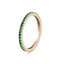 Load image into Gallery viewer, 14K yellow gold eternity band, adorned with 0.27tcw of vibrant round emeralds, representing eternal love and commitment, perfect for adding a touch of color and brilliance.

