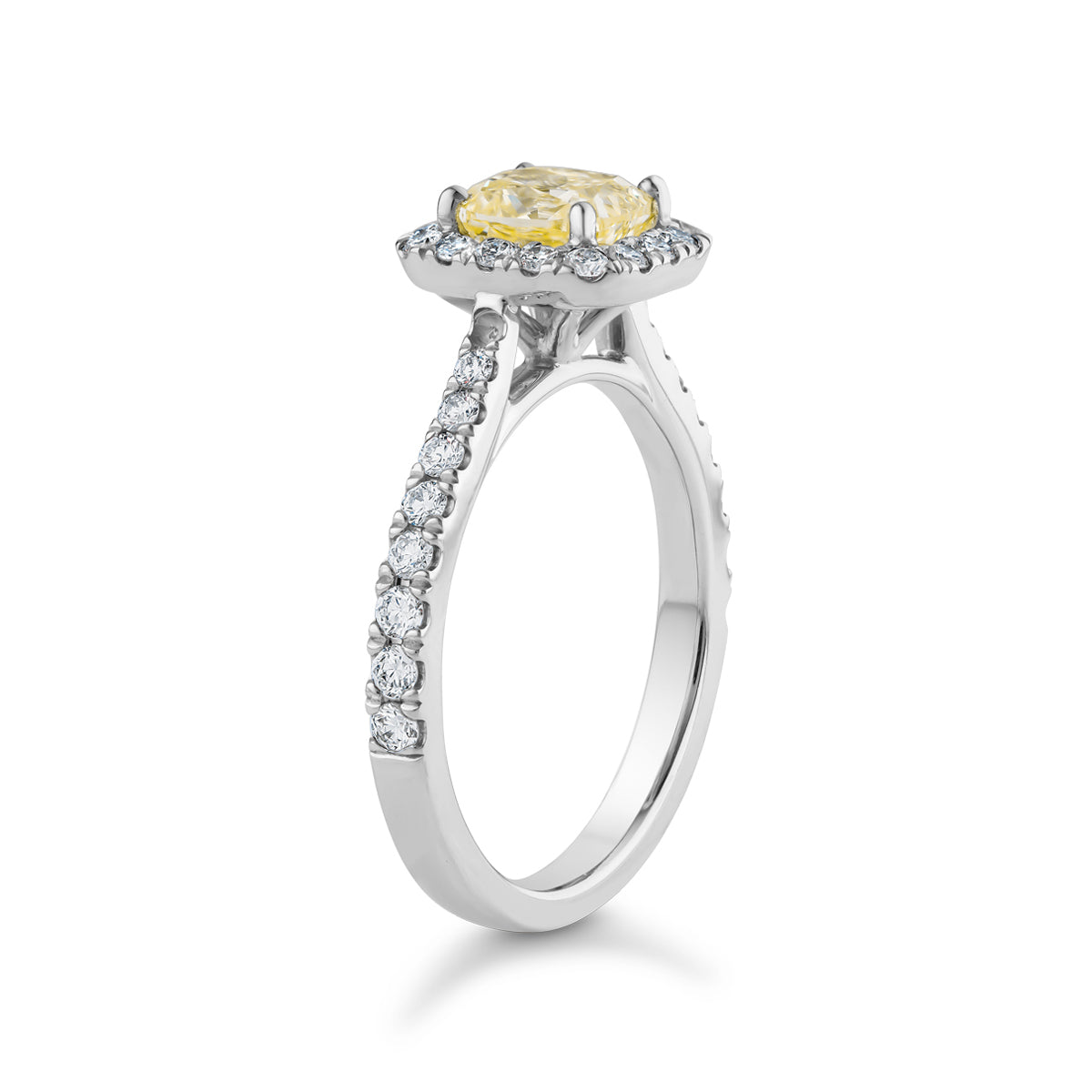 Luxurious ring in 18K white gold, featuring a 0.98ct fancy yellow diamond centerpiece surrounded by a halo and 34 diamonds totaling 0.48tcw, creating a dazzling display of brilliance and color.