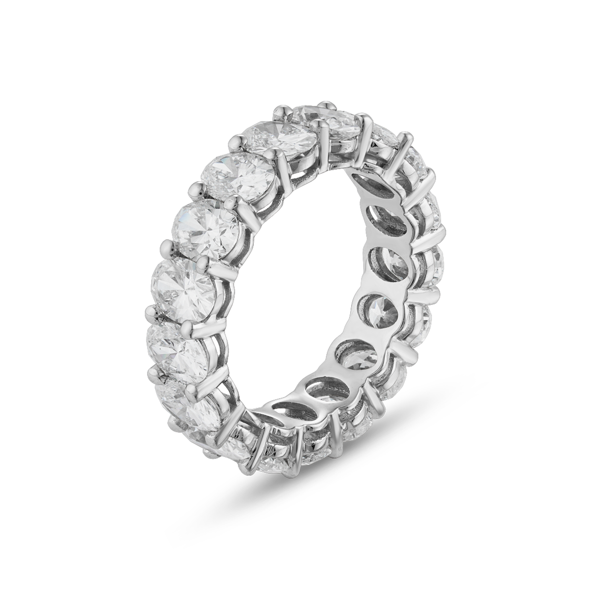 This 18K white gold full eternity band is a luxurious statement piece, featuring approximately 5.24tcw of oval lab-grown diamonds. The diamonds are set with two shared prongs, enhancing the band's sparkle from every angle.