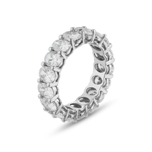 Charger l&#39;image dans la galerie, This 18K white gold full eternity band is a luxurious statement piece, featuring approximately 5.24tcw of oval lab-grown diamonds. The diamonds are set with two shared prongs, enhancing the band&#39;s sparkle from every angle.
