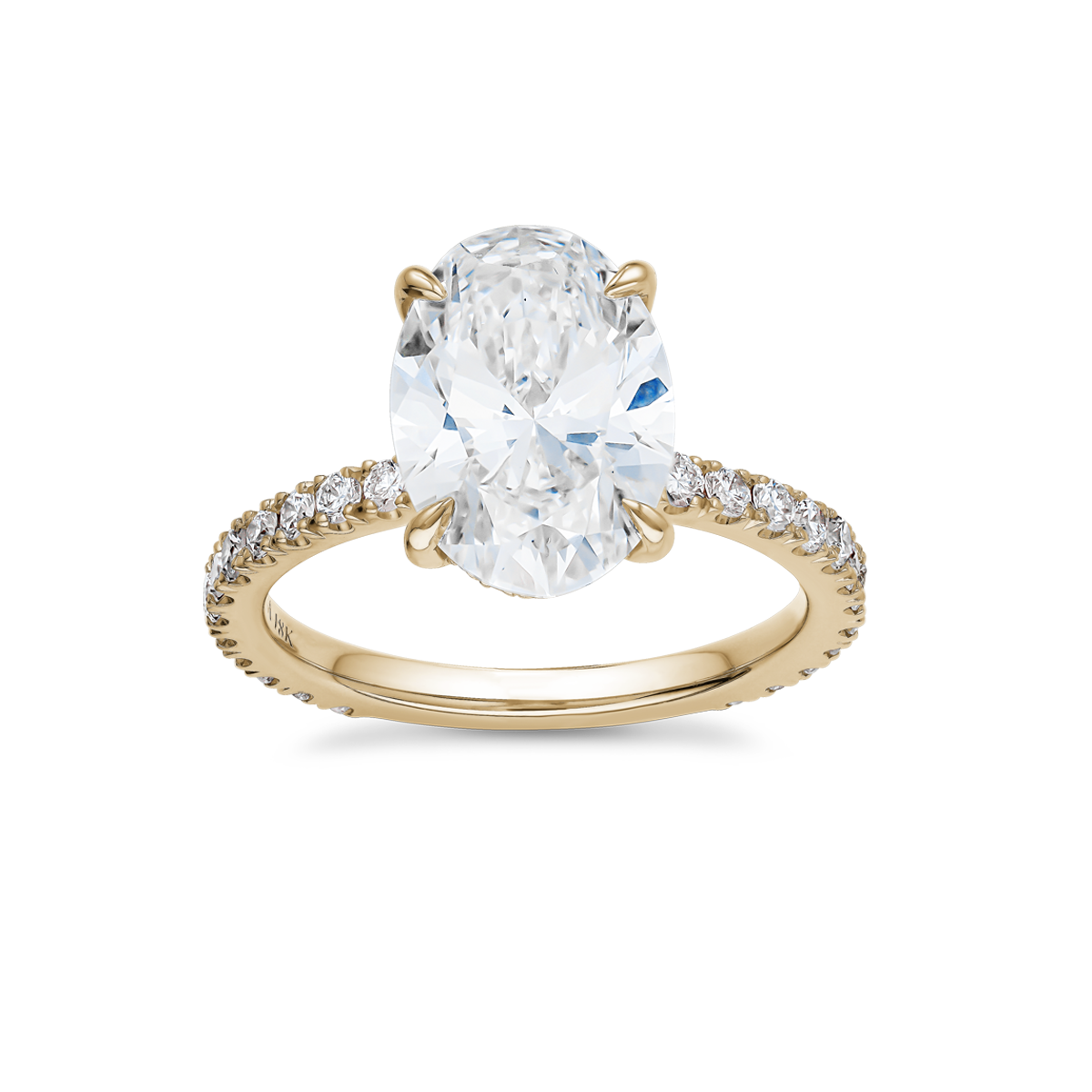 Luxurious engagement ring in 18K yellow gold, featuring a 3.09ct oval lab diamond (VS1 H) with a hidden pavé diamond halo and 0.55tcw of small round diamonds along the band, offering a blend of simplicity and detailed elegance.