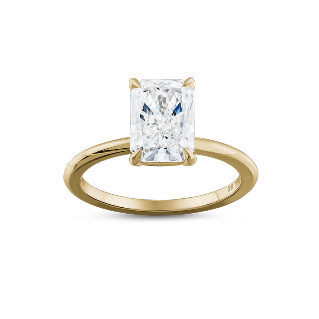 Solitaire in 18K white gold, featuring a 2.04ct radiant cut diamond in an eagle claw setting, embodying contemporary elegance with its simple yet striking design, handcrafted by Ex Aurum in Montreal.