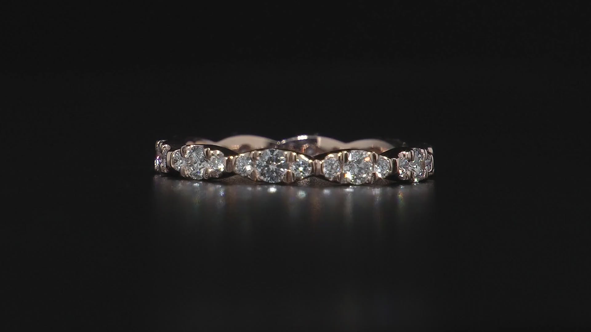 Video showing every angle of Golden Bloom. Dazzling full eternity ring in 18K yellow gold, featuring 1.05tcw of mixed-sized round brilliant diamonds pave set in leaflike sections, radiating life vitality and sparkling diamond fire.