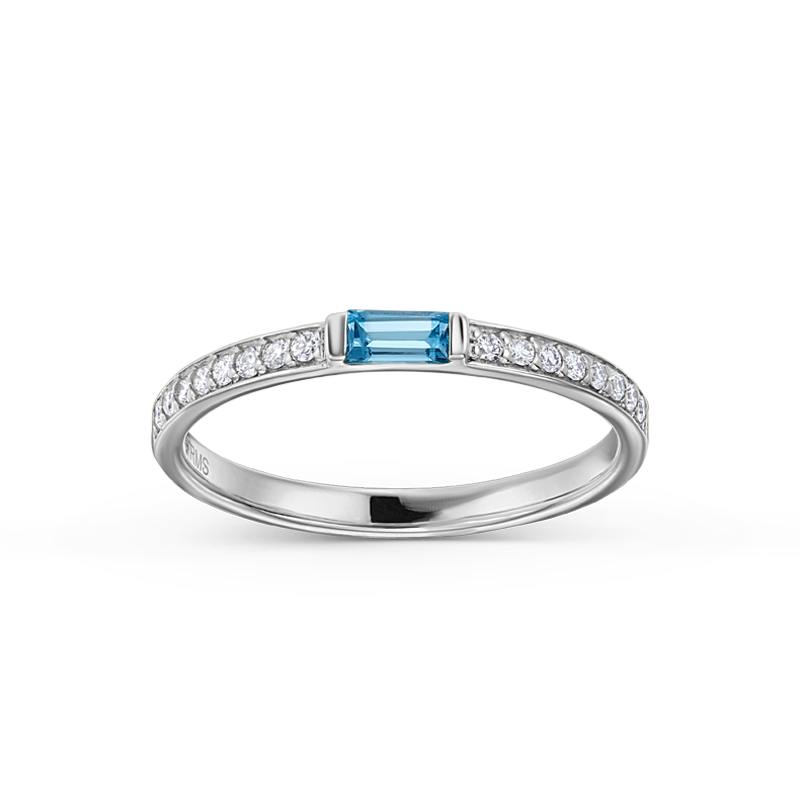 Elegant ring in 14K white gold, handcrafted by Ex Aurum in Montreal, featuring a soft sky-blue topaz baguette center with 0.13ctw diamond pavé along the sides, creating a refreshing and colorful touch.