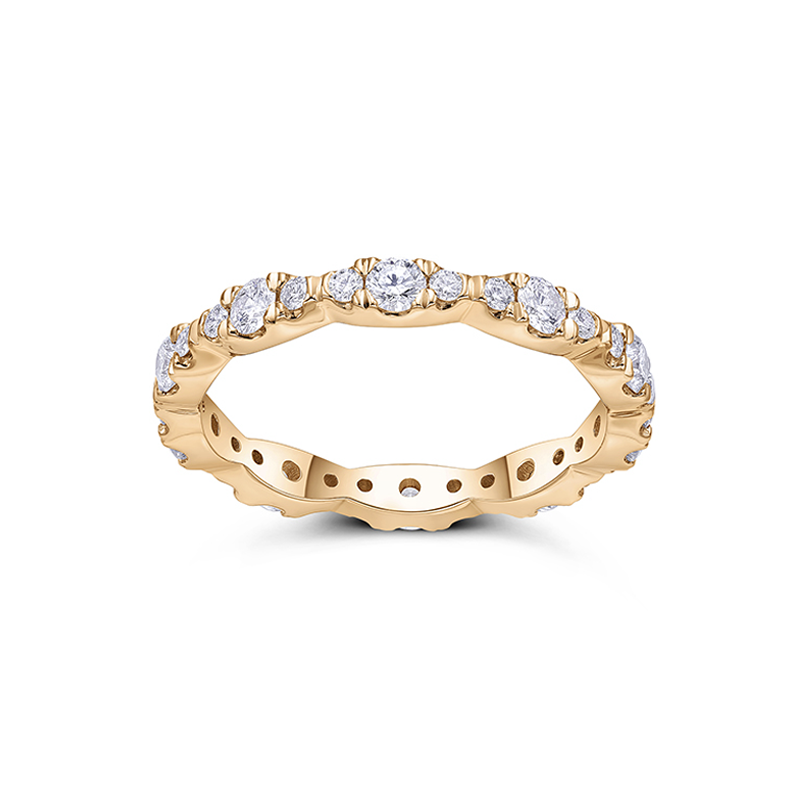 Dazzling full eternity ring in 18K yellow gold, featuring 1.05tcw of mixed-sized round brilliant diamonds pave set in leaflike sections, radiating life vitality and sparkling diamond fire.