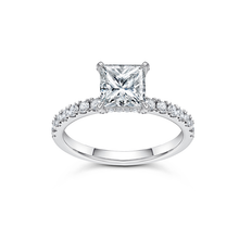 Load image into Gallery viewer, Solitaire engagement ring in 18K white gold, featuring a 1.20ct princess cut diamond with fine pavé set diamonds on the prongs and a hidden halo, totaling 0.47tcw, offering a blend of strong elegance and subtle details.
