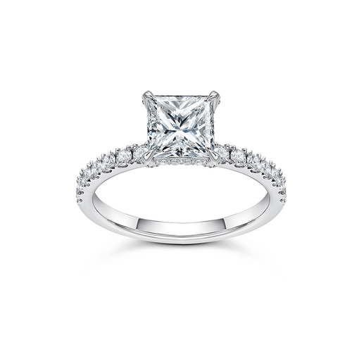 Solitaire engagement ring in 18K white gold, featuring a 1.20ct princess cut diamond with fine pavé set diamonds on the prongs and a hidden halo, totaling 0.47tcw, offering a blend of strong elegance and subtle details.